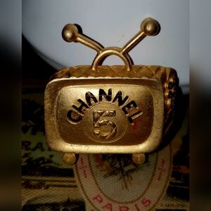 Gold toned Channel 5 TV pin
